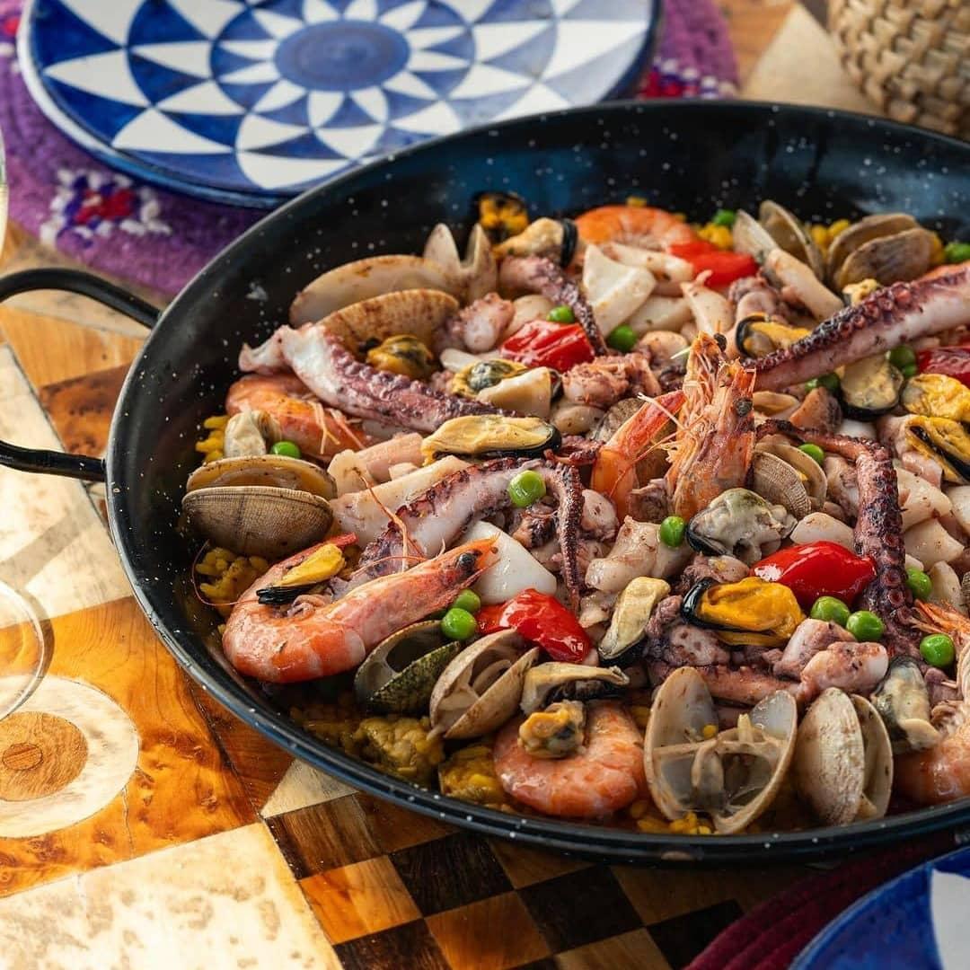 A vibrant seafood paella from Essaouira, showcasing the finest prawns, clams, mussels, and octopus, for an authentic coastal dining experience.