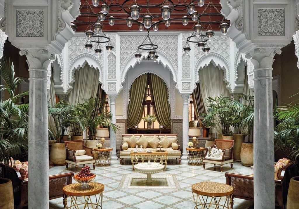 An exquisite example of Moroccan architecture at Royal Mansour, showcasing distinctive archways, intricate tile work, and carved wood details.