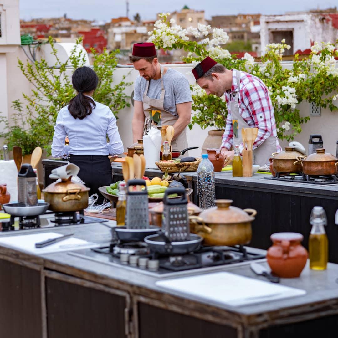 Guests participate in a rooftop cooking class at Palais Amani.